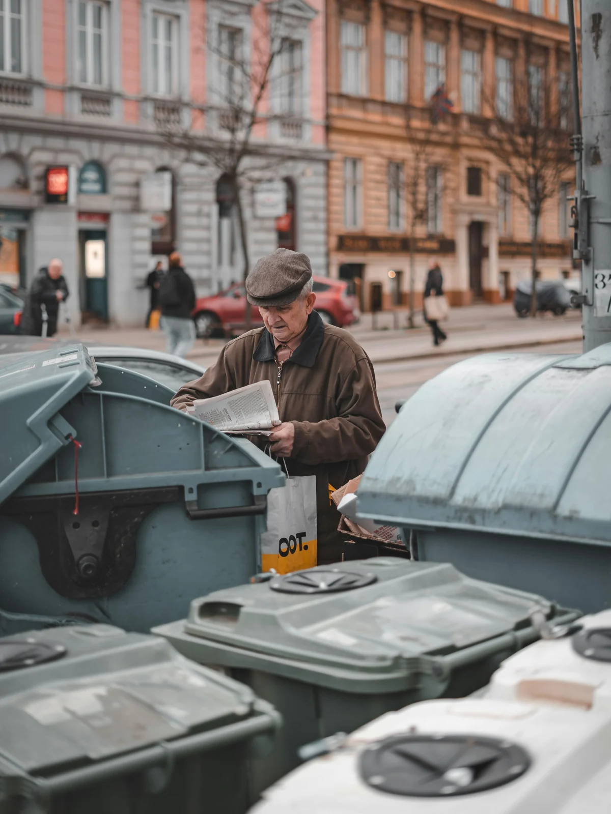 A resident sorting paper at communal bins