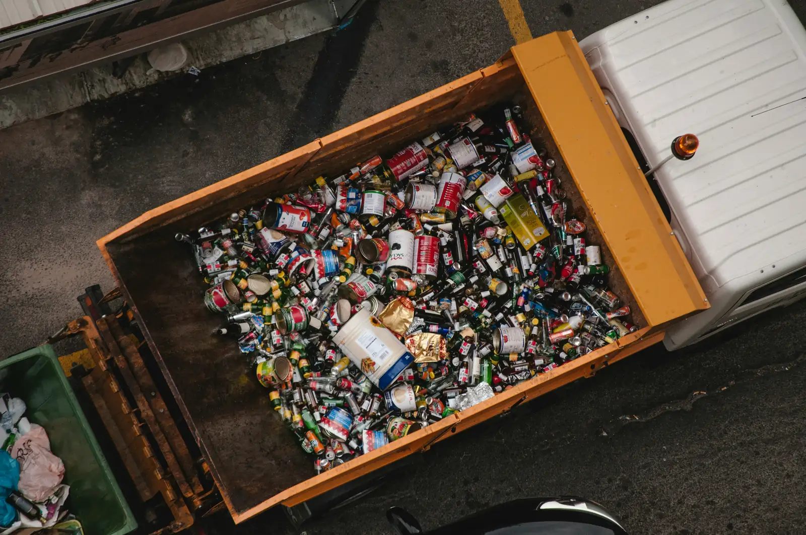 A tipper bed full of cans and bottles for recycling